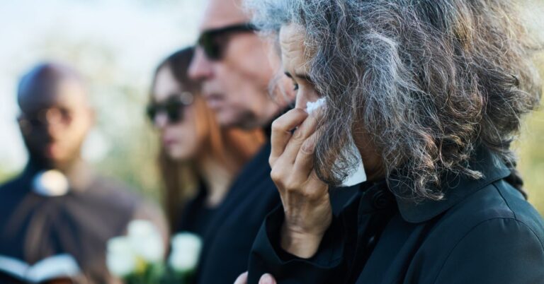 senior woman with grey hair wiping tears with hand 2023 11 27 05 22 58 utc
